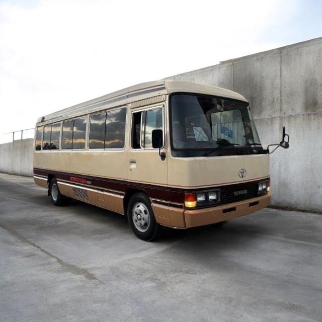 Toyota Coaster bus for group tours, seats 26 to 30